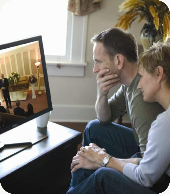A family watching a funeral live stream together